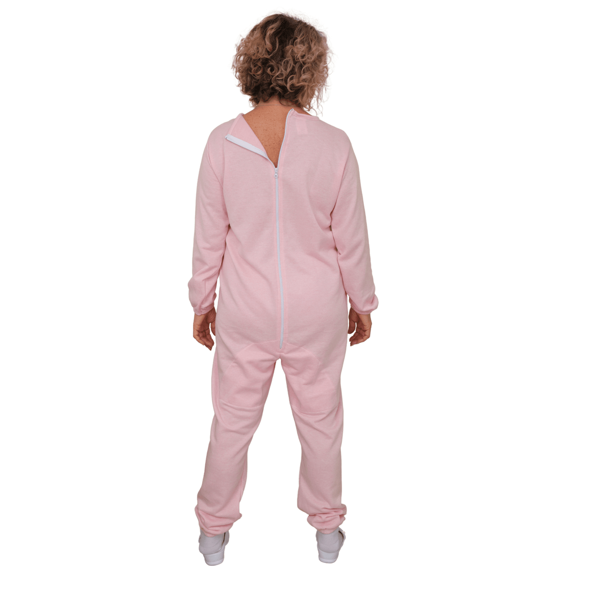 Pink long-sleeved winter pajamas by Ferrucci Comfort with back closure, designed as adaptive clothing for comfort and safety.