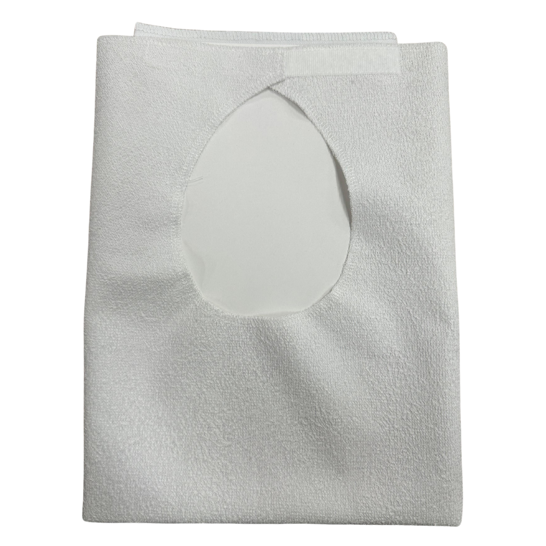 Adult bib by Ferrucci Comfort, model 9043, made of cotton terry with waterproof polyurethane backing and Velcro closure.