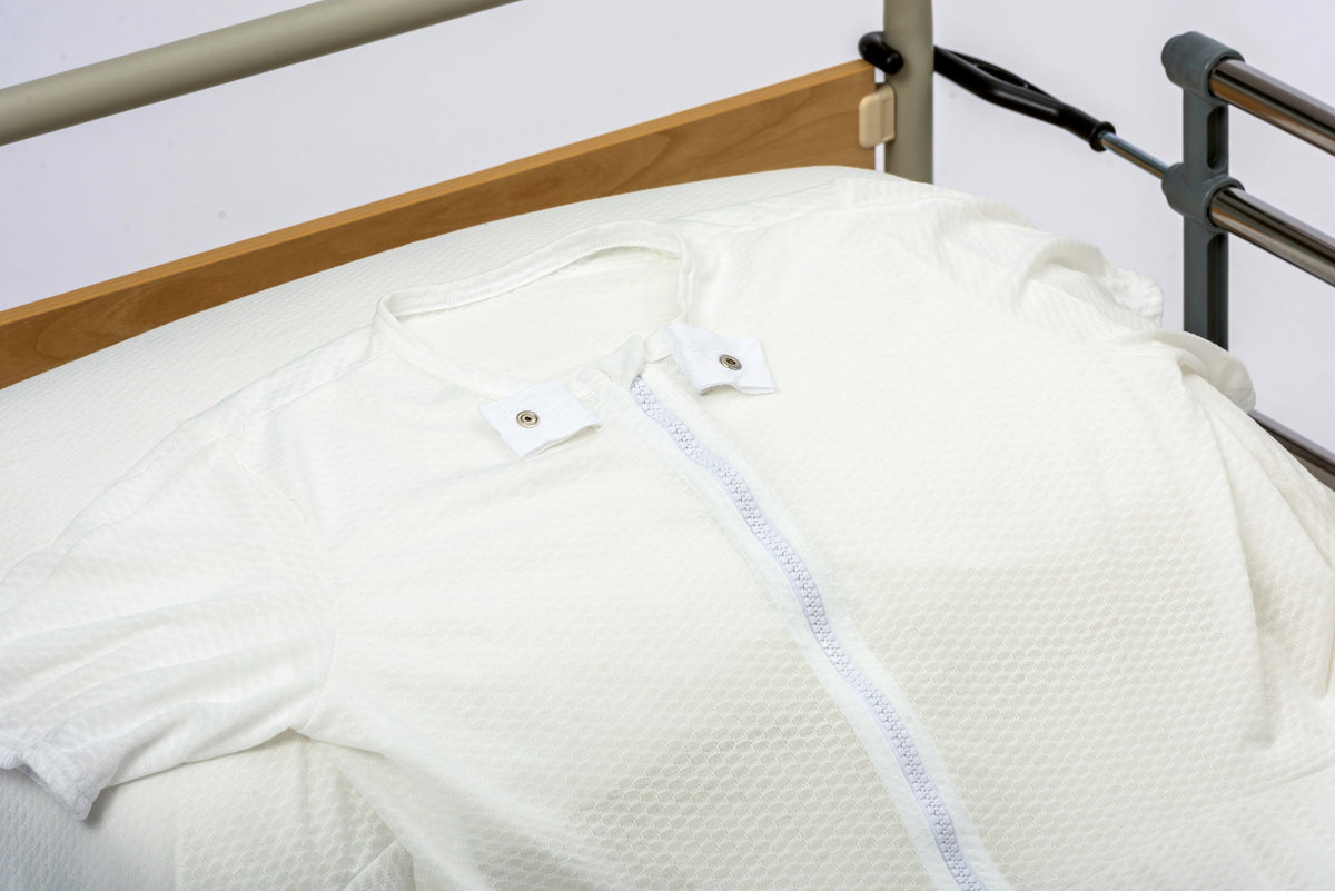 Ferrucci Comfort containment sheet spread flat, soft fabric designed for bed protection and patient comfort.