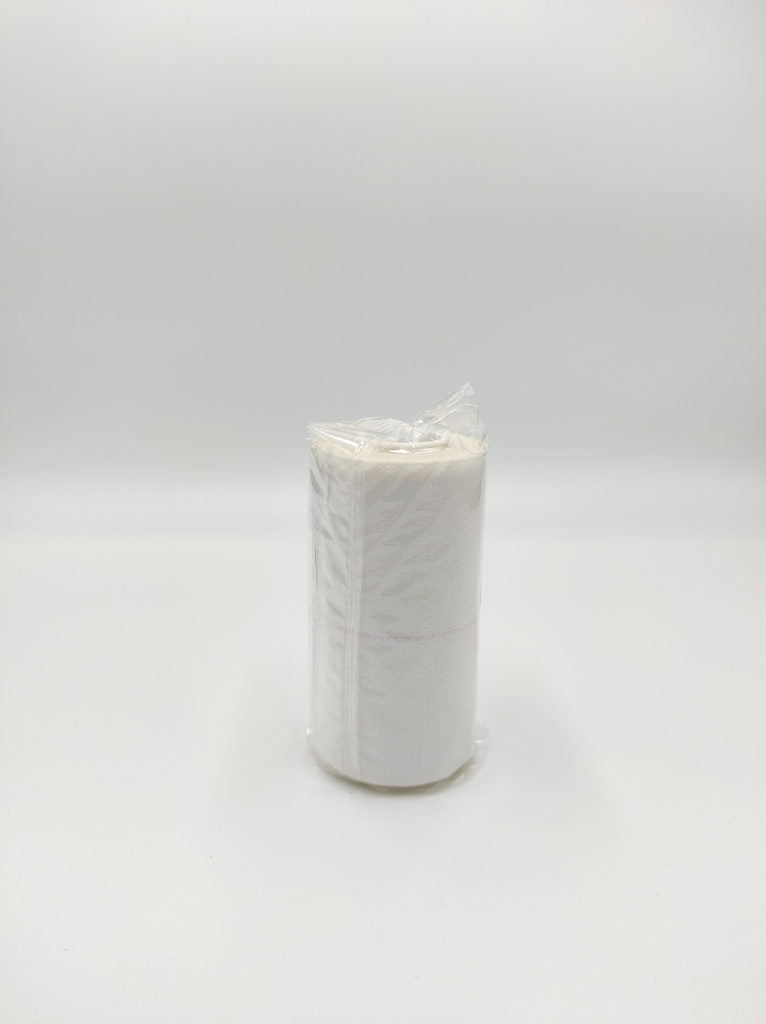 Ferrucci Comfort elastic adhesive bandage, 10 cm by 4.5 m, wrapped around a patient's arm for support and compression.
