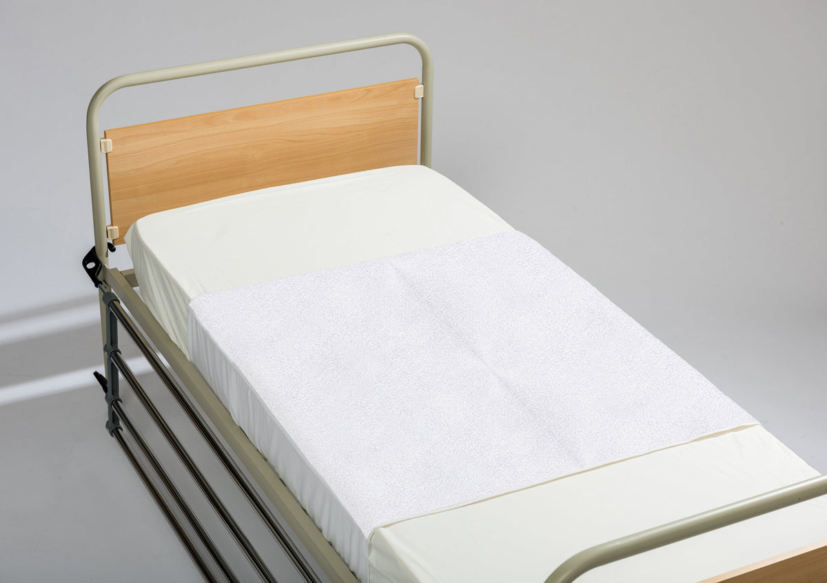 Ferrucci Comfort Purità protective sheet with flaps, waterproof bedding cover, and elastic edges for secure fit.