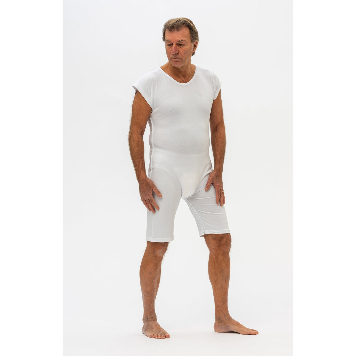 White Ferrucci Comfort Dolcezza bodysuit with rear zip, designed for adaptive clothing, shown on a model.